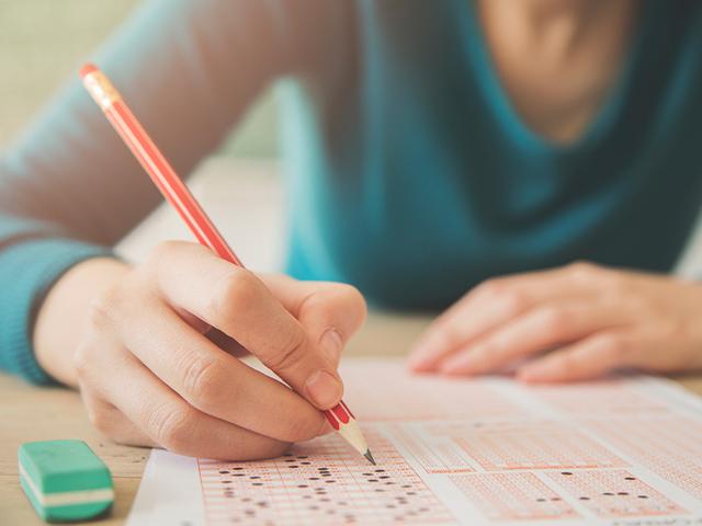 student taking a test filling in answer circles