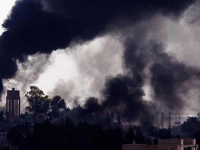 Smoke billows from targets inside Syria during bombardment by Turkish forces Thursday, Oct. 10, 2019. (AP Photo/Lefteris Pitarakis)