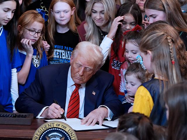 President Donald Trump signs an executive order barring transgender female athletes from competing in women&#039;s or girls&#039; sporting events, in the East Room of the White House, Wednesday, Feb. 5, 2025, in Washington. (AP Photo/Alex Brandon)