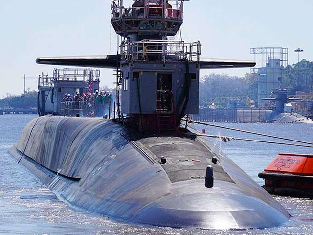 The Ohio-class guided-missile submarine USS Georgia (SSGN 729) exits the dry dock at Naval Submarine Base Kings Bay, Ga. Photo Credit: NARA &amp; DVIDS Public Domain Archive.