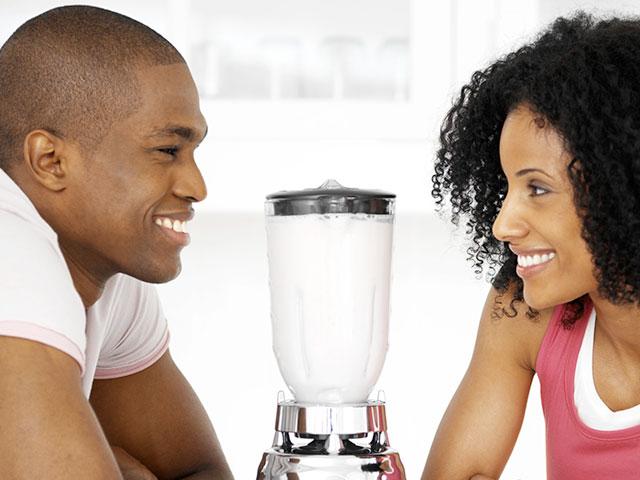 young couple with blender