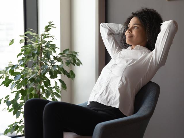 woman looking hopeful sitting in an office chair