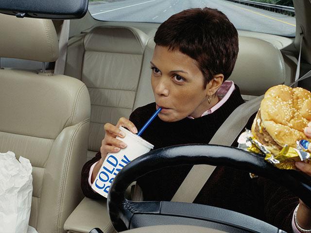 Woman eating fast food