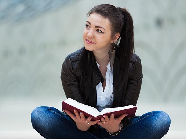 Young woman reading a book