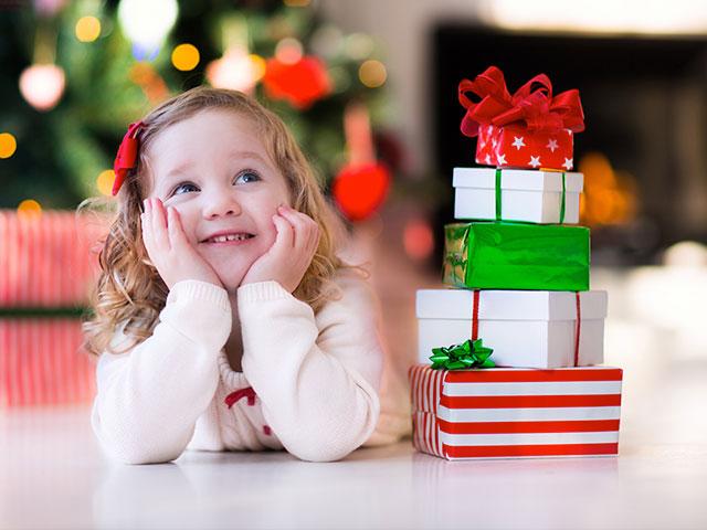 Young girl with Christmas gifts