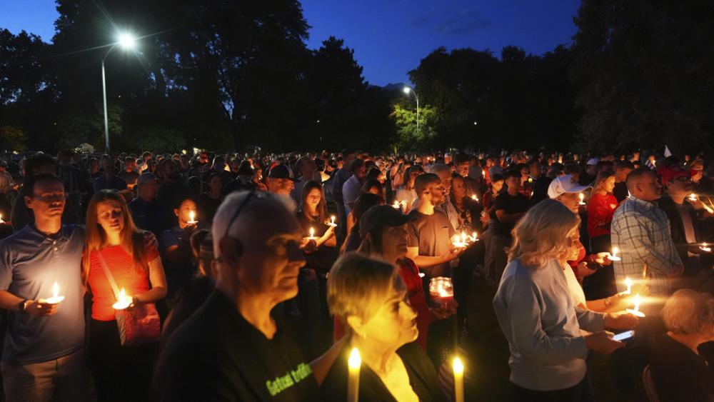 Attendees pay their respects during a vigil for Charlie Kirk on Friday, Sept. 12, 2025, in Provo, Utah. (AP Photo/Lindsey Wasson)