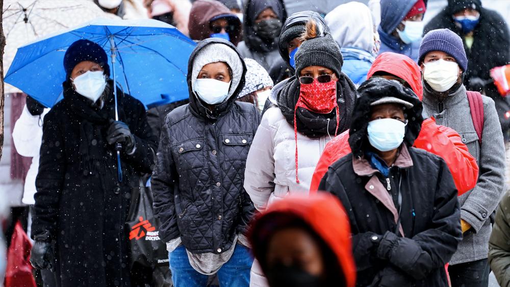 People wait in line at a 24-hour, walk-up COVID-19 vaccination clinic hosted by the Black Doctors COVID-19 Consortium at Temple University&#039;s Liacouras Center in Philadelphia. (AP Photo/Matt Rourke, File)