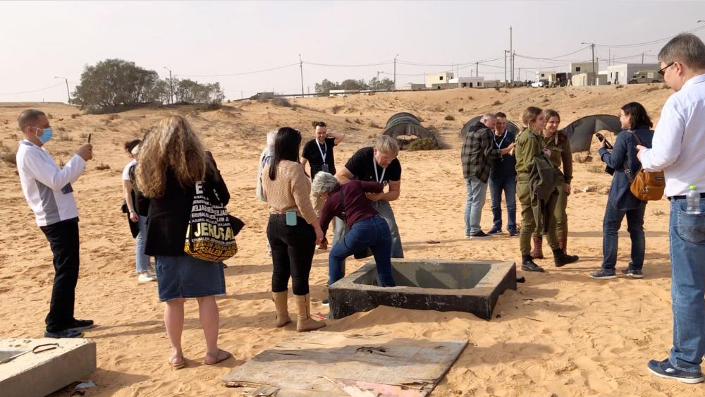 International Christian journalists tour a model of a Hamas &quot;Terror Tunnel&quot; where Israeli soldiers train to fight and defend Israel. Photo Credit: CBN News. 