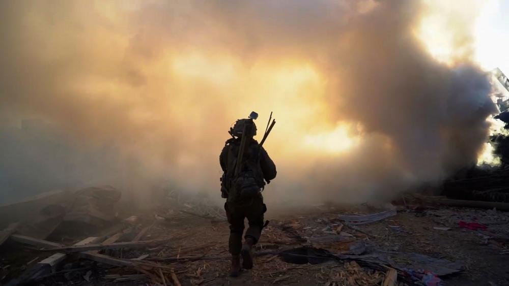 Soldier walking in Gaza. Photo Credit: IDF Spokesperson. 