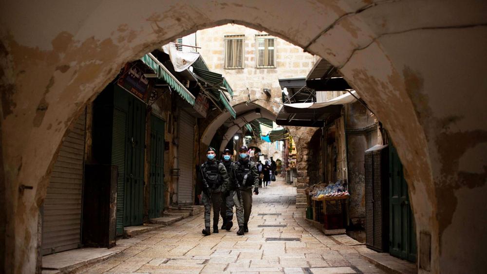 Israeli police patrol the Muslim Quarter of the Old City of Jerusalem, Friday, Jan. 15, 2021 during the country&#039;s third lockdown. (AP Photo/Maya Alleruzzo)