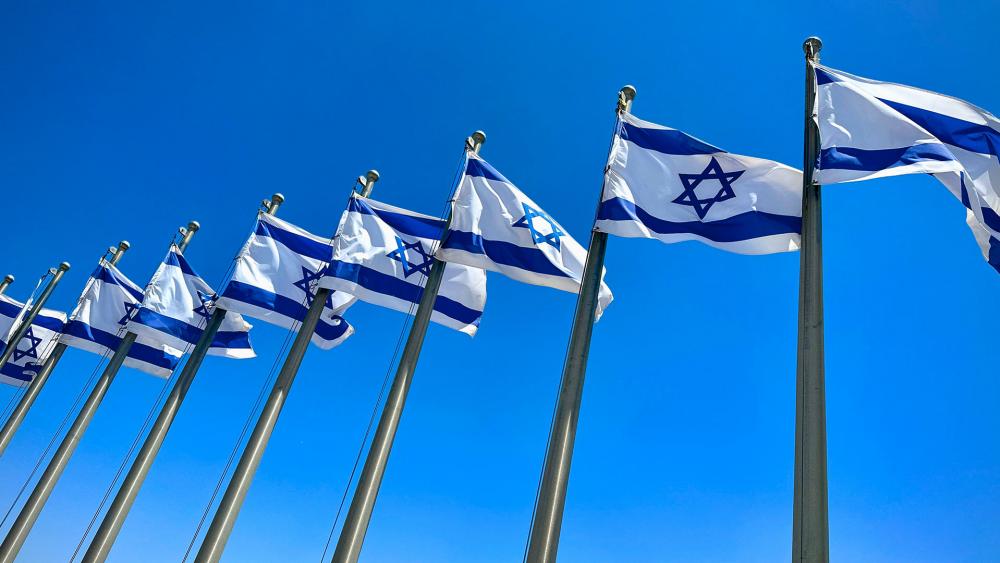 Flags flying in front of the Israeli Knesset. Photo Credit: CBN News.