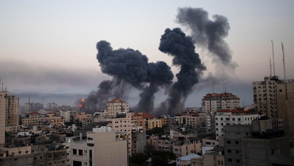 Smoke rises after Israeli airstrikes on Gaza City, Wednesday, May 12, 2021. (AP Photo/Khalil Hamra)