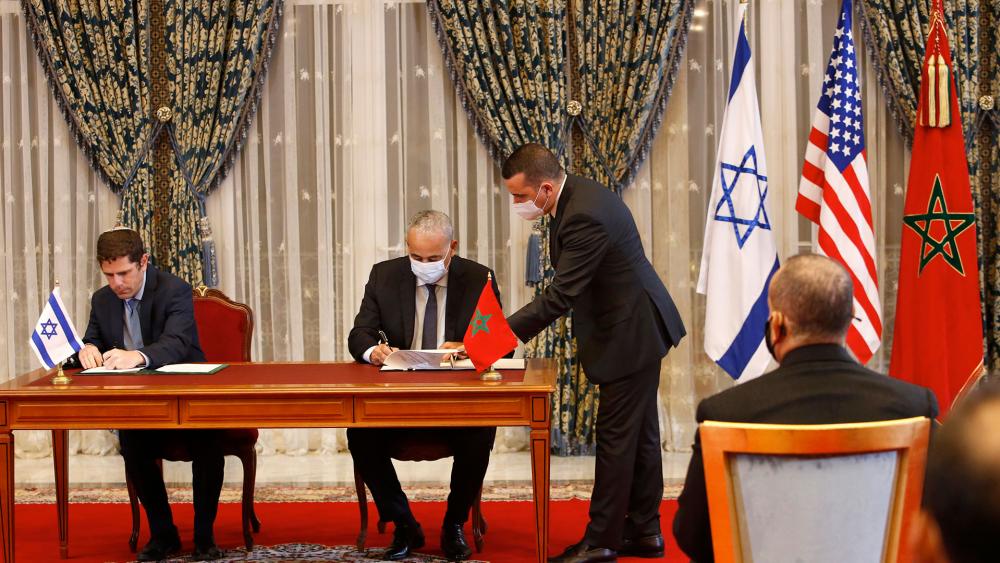 In this Dec. 22, 2020 file photo, Morocco and Israel sign normalization agreements. (AP Photo/Abdeljalil Bounhar, File)