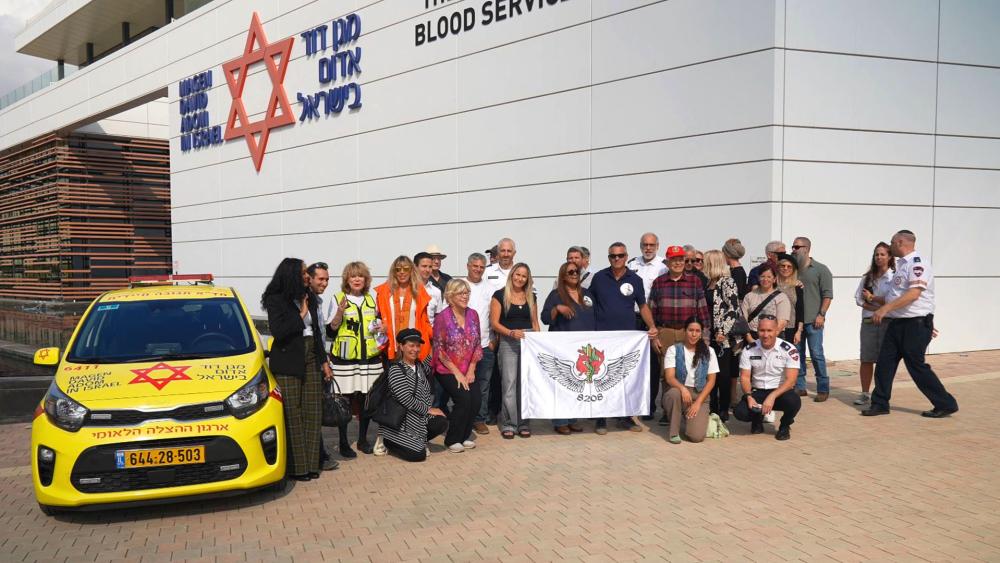 Families of slain Israelis and donors of medical vehicles gather for a dedication in Ramle, Israel. Photo credit: CBN News.