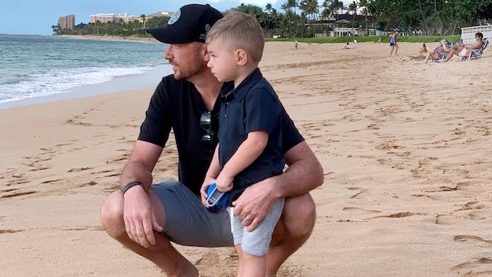 Palmer with his son during one of their annual trips to the beach where he met Ethan. Photo credit: Aaron Palmer