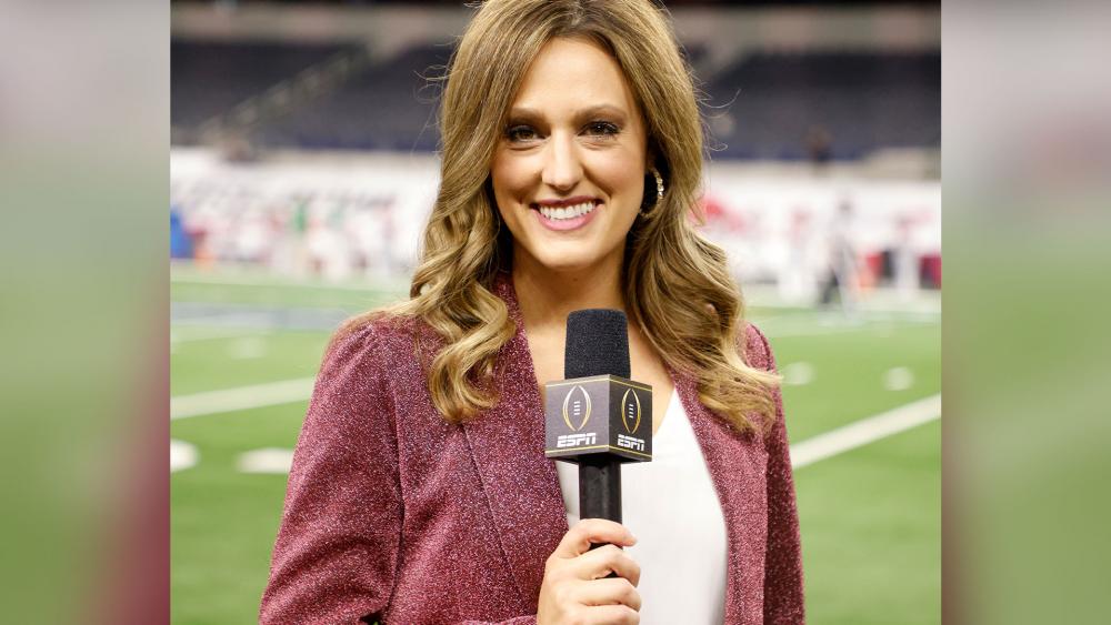 Allison Williams, sideline reporter with ESPN poses for a photo on the field at AT&amp;T Stadium before the Rose Bowl NCAA college football game between Notre Dame and Alabama in Arlington, Texas, Friday, Jan. 1, 2021. (AP Photo/Michael Ainsworth)