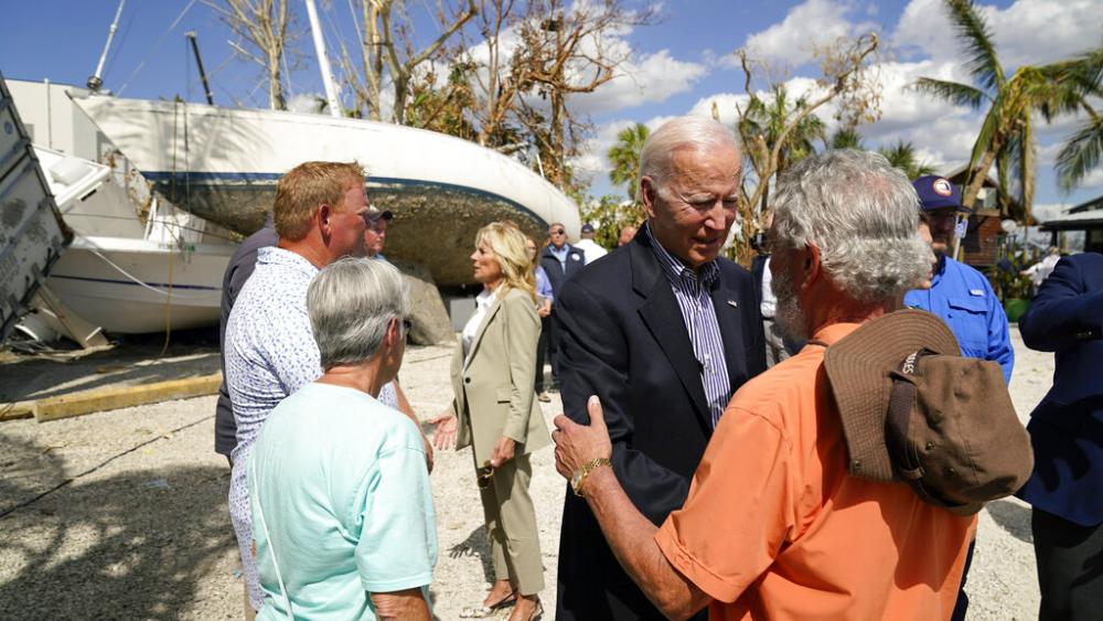 President Joe Biden and first lady Jill Biden talk to people impacted by Hurricane Ian during a tour of the area on Wednesday, Oct. 5, 2022, in Fort Myers Beach, Fla. (AP Photo/Evan Vucci)