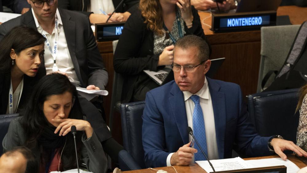 Israeli UN Ambassador Gilad Erdan, right, attends a meeting of the Special Political and Decolonization Committee at U.N. headquarters on Friday, Nov. 11, 2022. (AP Photo/Jeenah Moon, File)