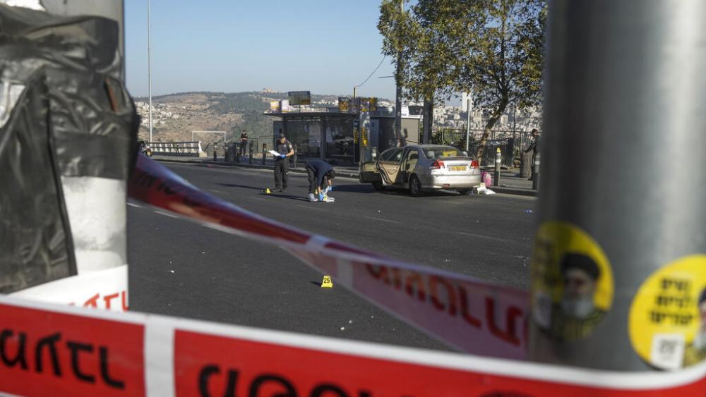 Israeli police inspect the scene of an explosion at a bus stop in Jerusalem. Wednesday, Nov. 23, 2022. At least a dozen were injured. Police suspect terrorism.  (AP Photo/Maya Alleruzzo)