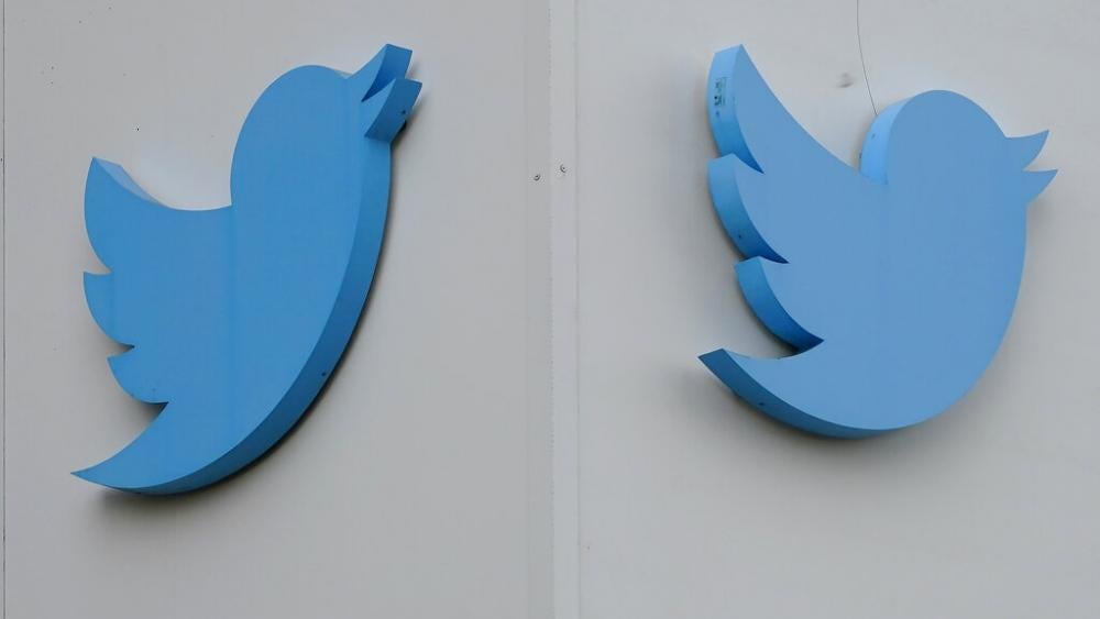 Twitter logos hang outside the company&#039;s offices in San Francisco, Monday, Dec. 19, 2022. (AP Photo/Jeff Chiu)