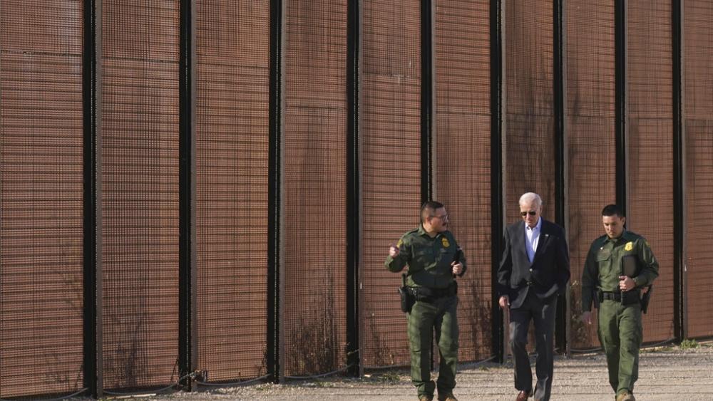 President Joe Biden walks with U.S. Border Patrol agents along a stretch of the U.S.-Mexico border in El Paso Texas, Sunday, Jan. 8, 2023. (AP Photo/Andrew Harnik)