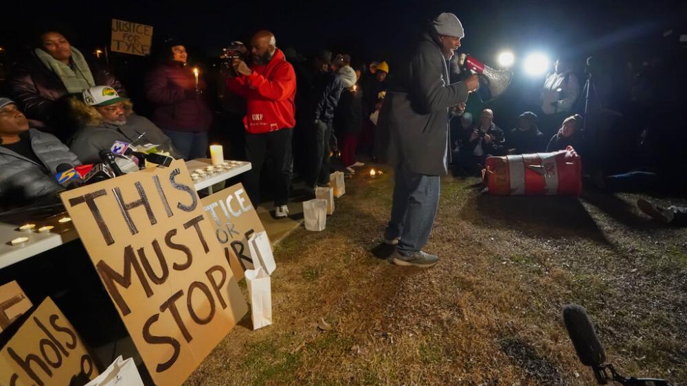 Rev. Andre E Johnson, of the Gifts of Life Ministries, preaches at a candlelight vigil for Tyre Nichols, who died after being beaten by Memphis police officers, in Memphis, Tenn., Thursday, Jan. 26, 2023. (AP Photo/Gerald Herbert)