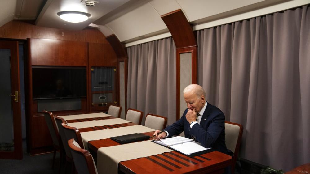 President Joe Biden sits on a train after a surprise visit with Ukrainian President Volodymyr Zelenskyy, Monday, Feb. 20, 2023, in Kyiv. (AP Photo/ Evan Vucci, Pool)