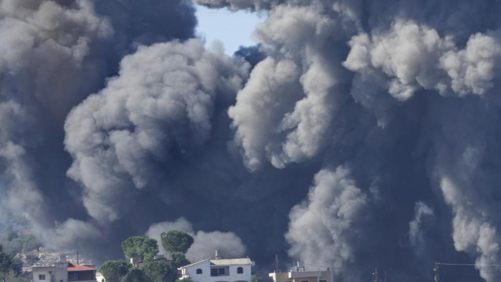 Black smoke rises from an Israeli airstrike on the outskirts of Aita al-Shaab, a Lebanese border village with Israel in south Lebanon, Saturday, Nov. 4, 2023. (AP Photo/Hussein Malla)