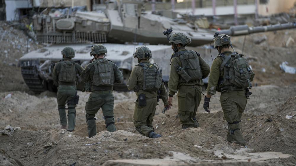 Israeli soldiers are seen during a ground operation in the Gaza Strip, Wednesday, Nov. 8, 2023.  (AP Photo/Ohad Zwigenberg)