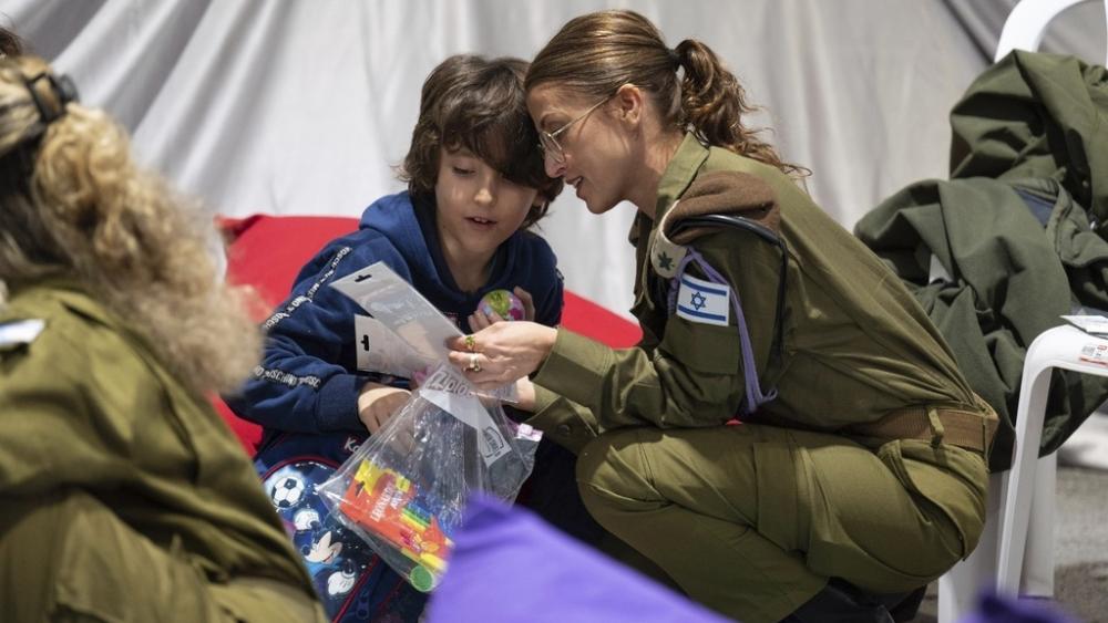 This handout photo provided by the Israel Prime Minister Office shows Naveh Shoham, 8 years old, upon his arrival in Israel after being freed. (Israel Prime Minister Office/Handout via AP)