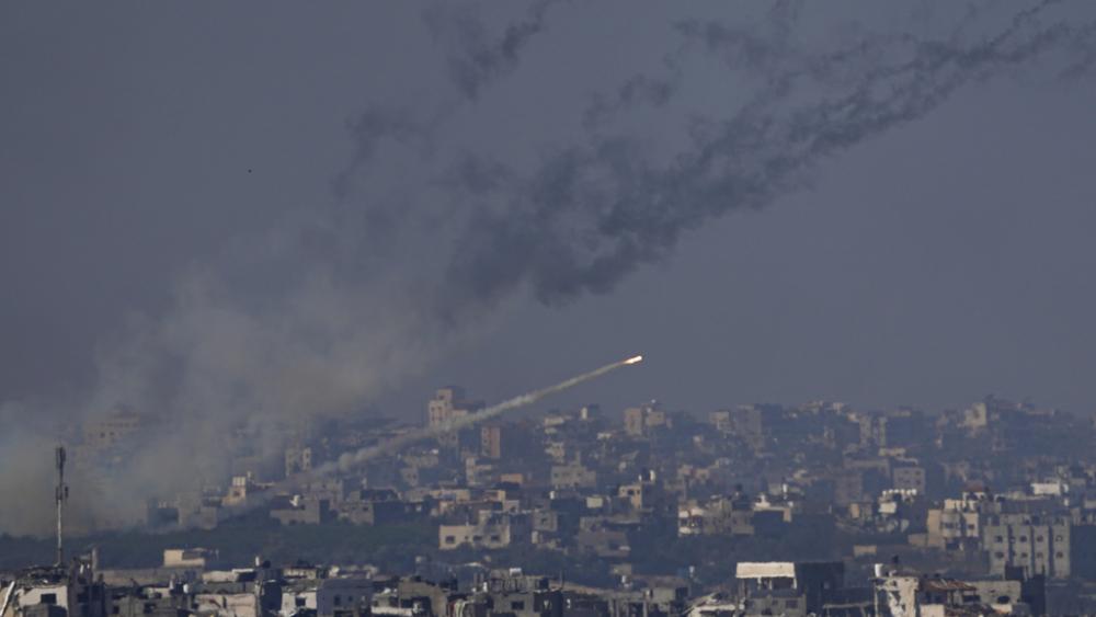 Rockets are fired toward Israel from the Gaza Strip, as seen from southern Israel, Friday, Dec. 1, 2023. (AP Photo/Ariel Schalit)