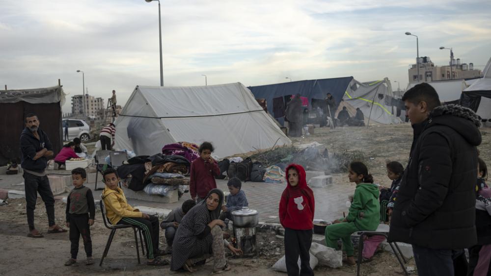 Palestinians displaced by the Israeli ground offensive on the Gaza Strip set up a tent camp in the Muwasi area Thursday, Dec. 7, 2023. AP Photo/Fatima Shbair)