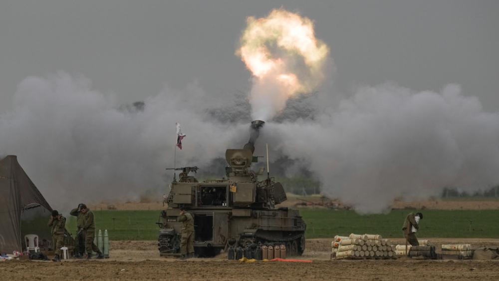 An Israeli mobile artillery unit fires a shell from southern Israel towards the Gaza Strip, in a position near the Israel-Gaza border on Sunday, Dec. 10, 2023. (AP Photo/Leo Correa)