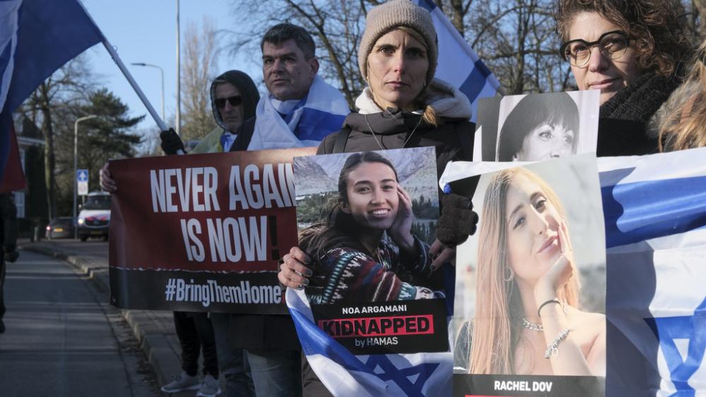 Pro-Israel activists gather near the International Court of Justice, or World Court, in The Hague, Netherlands, Friday, Jan. 26, 2024.  (AP Photo/Patrick Post)
