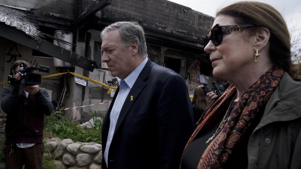 Former U.S. Secretary of State Mike Pompeo, and his wife, Susan, tour Kibbutz Kfar Azza, southern Israel, near the Gaza border, Tuesday, Feb. 13, 2024, the site of a cross-border attack by Hamas on Oct. 7, 2023. (AP Photo/Maya Alleruzzo)