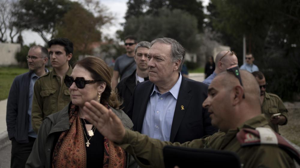 Former U.S. Secretary of State Mike Pompeo and his wife, Susan tour Kibbutz Kfar Azza, southern Israel, near the Gaza border, Tuesday, Feb. 13, 2024, the site of a cross-border attack by Hamas on Oct. 7, 2023. (AP Photo/Maya Alleruzzo)