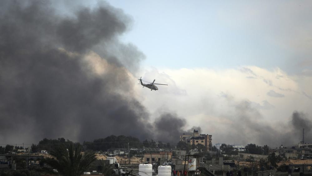 Israeli helicopter flies over Khan Younis, Gaza Strip, Thursday, Feb. 15, 2024. (AP Photo/Mohammed Dahman)