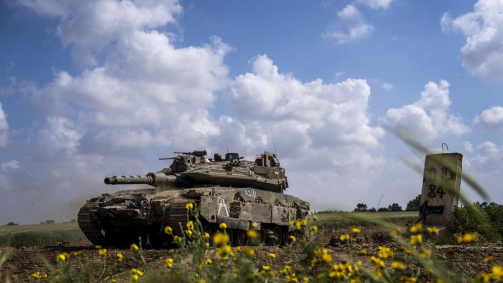 Israeli soldiers drive a tank on the border with Gaza Strip, in southern Israel, Tuesday, March 19, 2024. The army is battling Palestinian militants across Gaza in the war ignited by Hamas&#039; Oct. 7 attack into Israel. (AP Photo/Ariel Schalit)