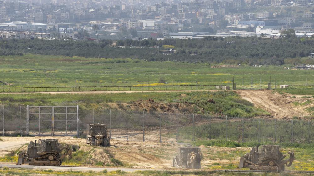Israeli army bulldozers are seen near the Gaza Strip border, in southern Israel, Thursday, March 21, 2024. (AP Photo/Ohad Zwigenberg)