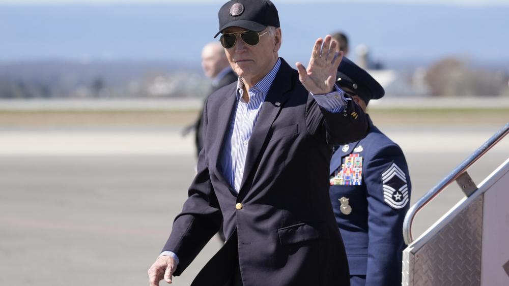 President Joe Biden waves as he arrives Air Force One, Tuesday, March 29, 2024, in Hagerstown, Md. Biden is en route to Camp David.(AP Photo/Alex Brandon)