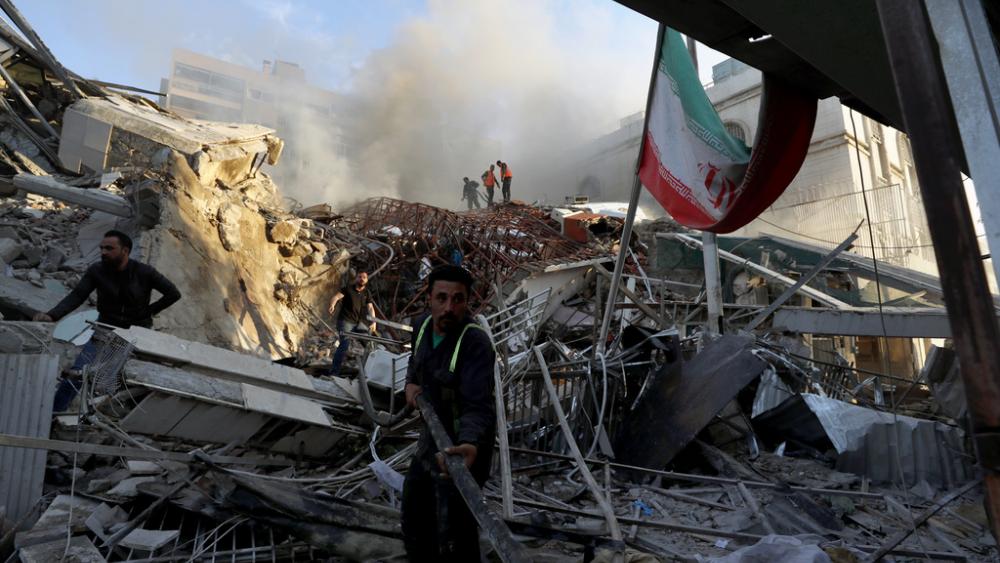 Emergency services work at a building hit by an air strike in Damascus, Syria, Monday, April 1, 2024. The airstrike that demolished Iran’s consulate killed two Iranian generals and five officers. (AP Photo/Omar Sanadiki)