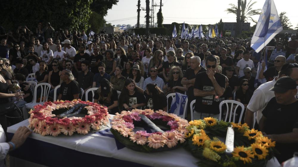 Israelis attend the funeral of Hanan Yablonka, who was killed during Hamas&#039; Oct. 7, 2023 attack and whose body was taken into Gaza, during his funeral in Tel Aviv, Israel, on Sunday, May 26, 2024. (AP Photo/Oded Balilty)