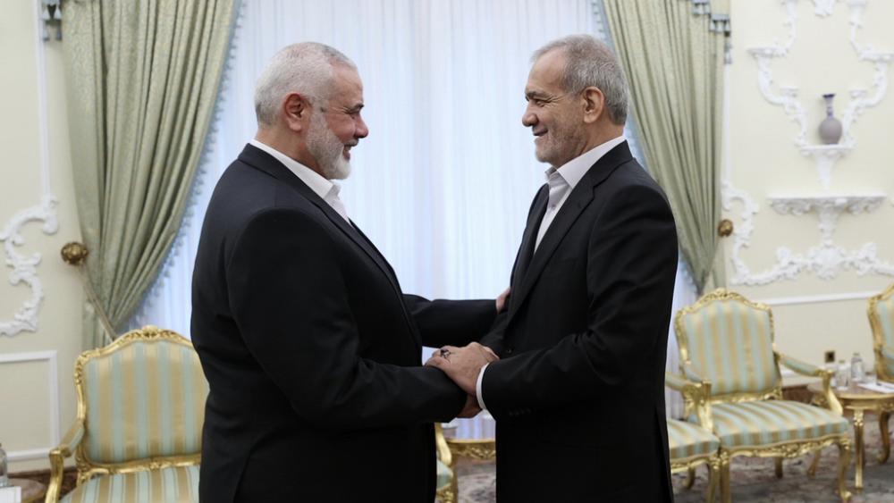 In this photo, President Masoud Pezeshkian, right, greets Hamas chief Ismail Haniyeh at the start of their meeting at the President&#039;s office in Tehran, Iran, Tuesday, July 30, 2024. (Iranian Presidency Office via AP)