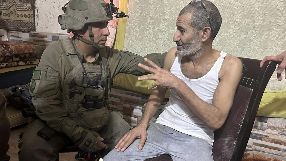  In this photo released by Israeli Defense Forces on Aug. 27, 2024, Qaid Farhan Alkadi, right, and the commanding officer of the 162nd Division, Brig. Gen. Itzik Cohen, talk after a rescue operation to free Alkadi. (Israeli Defense Forces via AP, File)