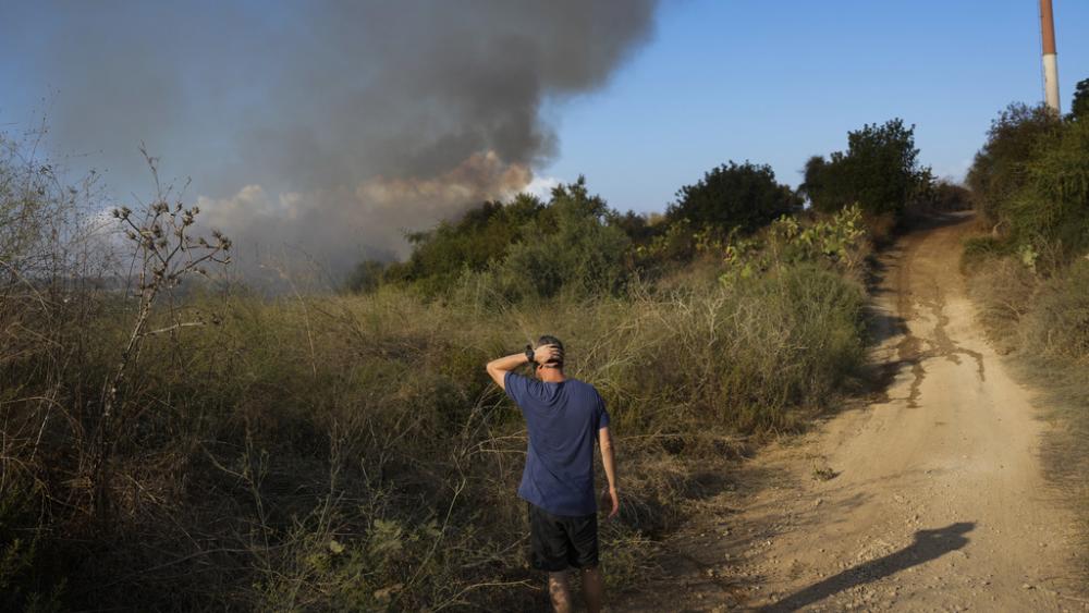 Smoke rises from a fire in central Israel after the Israeli army said a missile fired from Yemen landed in an open area on Sunday, Sept. 15, 2024. (AP Photo/Ohad Zwigenberg)