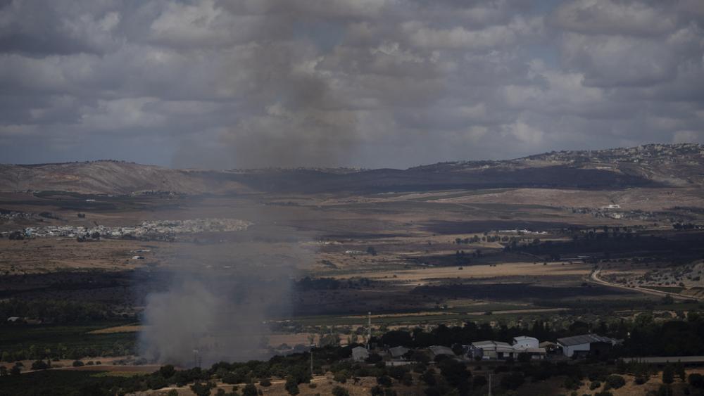 Smoke rises to the sky as fire burns in an area, following an attack from Lebanon, near the Kibbutz Snir, as seen from the Israeli Golan Heights, Monday, Sept. 16, 2024. (AP Photo/Leo Correa)