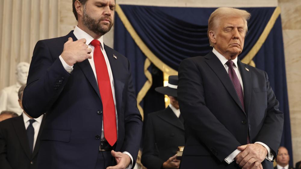 Vice President JD Vance and President Trump pray during inauguration ceremonies in the Rotunda of the U.S. Capitol  (Chip Somodevilla/Pool Photo via AP)