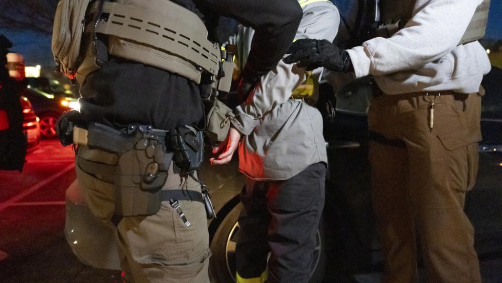 U.S. Immigration and Customs Enforcement officers restrain a detained person, Jan. 27, 2025, in Silver Spring, Md. (AP Photo/Alex Brandon)