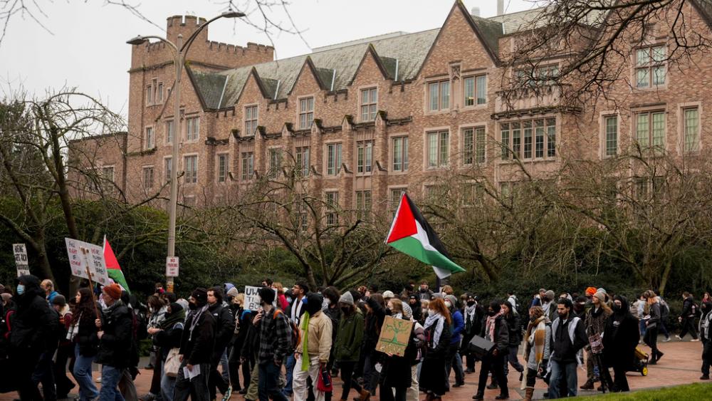 A pro-Palestinian protest marches at the University of Washington campus Wednesday, Feb. 5, 2025, in Seattle. (AP Photo/Lindsey Wasson)