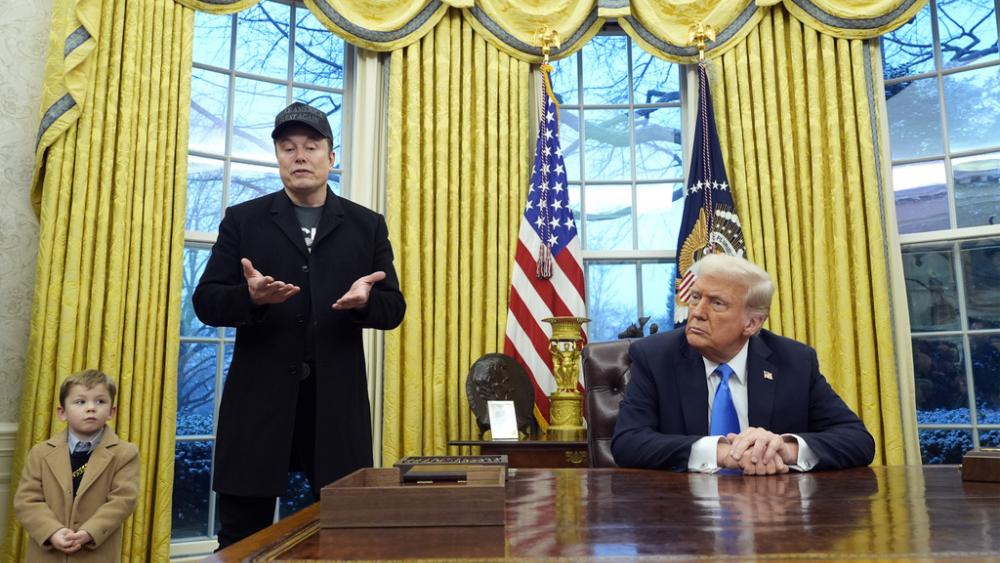 President Donald Trump listens as Elon Musk, joined by his son X Æ A-Xii, speaks in the Oval Office at the White House, Tuesday, Feb. 11, 2025, in Washington. (Photo/Alex Brandon)
